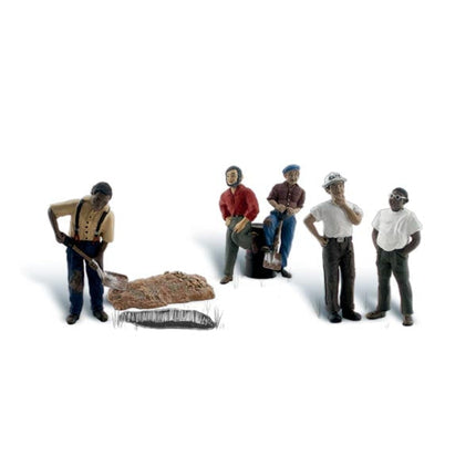 One Man Crew - HO Scale - Add this scene to your layout, with five workers&hellip;uh, make that one worker, four supervisors and a barrel! 
Set contains 7 pieces