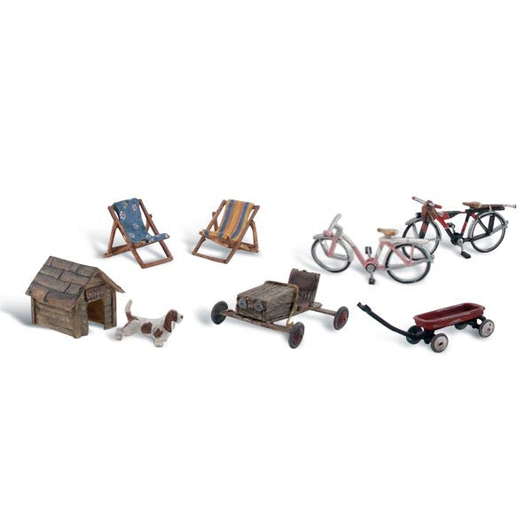 Backyard Basics - HO Scale - What&rsquo;s a backyard without bicycles, lawn chairs, toys and a little pup and his doghouse