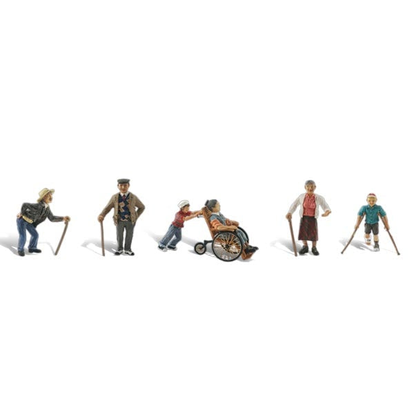 Physically Challenged - HO Scale - Two elderly men and a woman hobble on canes while a youth cruises by on crutches, and a young boy pushes grandma in her wheelchair